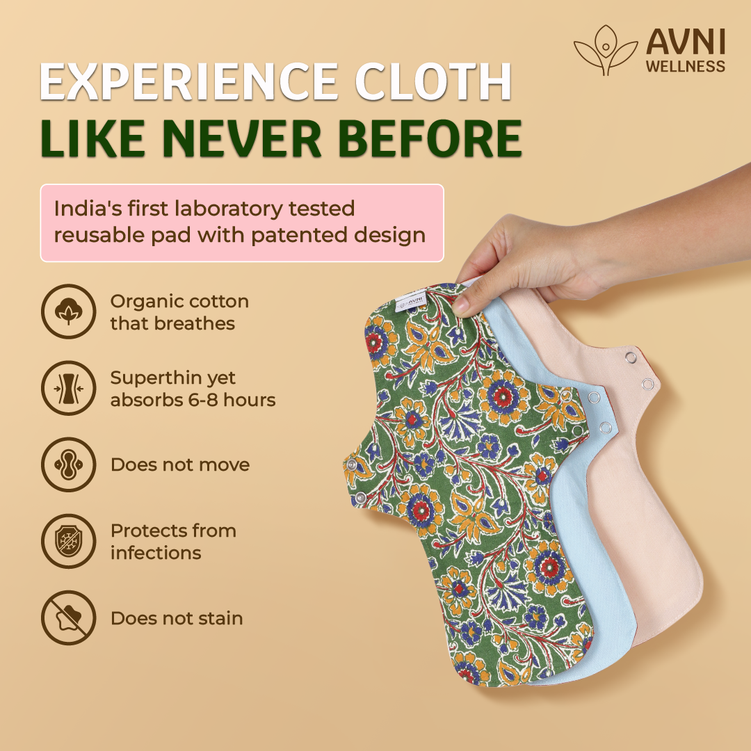 reusable pads for heavy periods with floral design held by a hand, branded as Avni Wellness on a beige background.